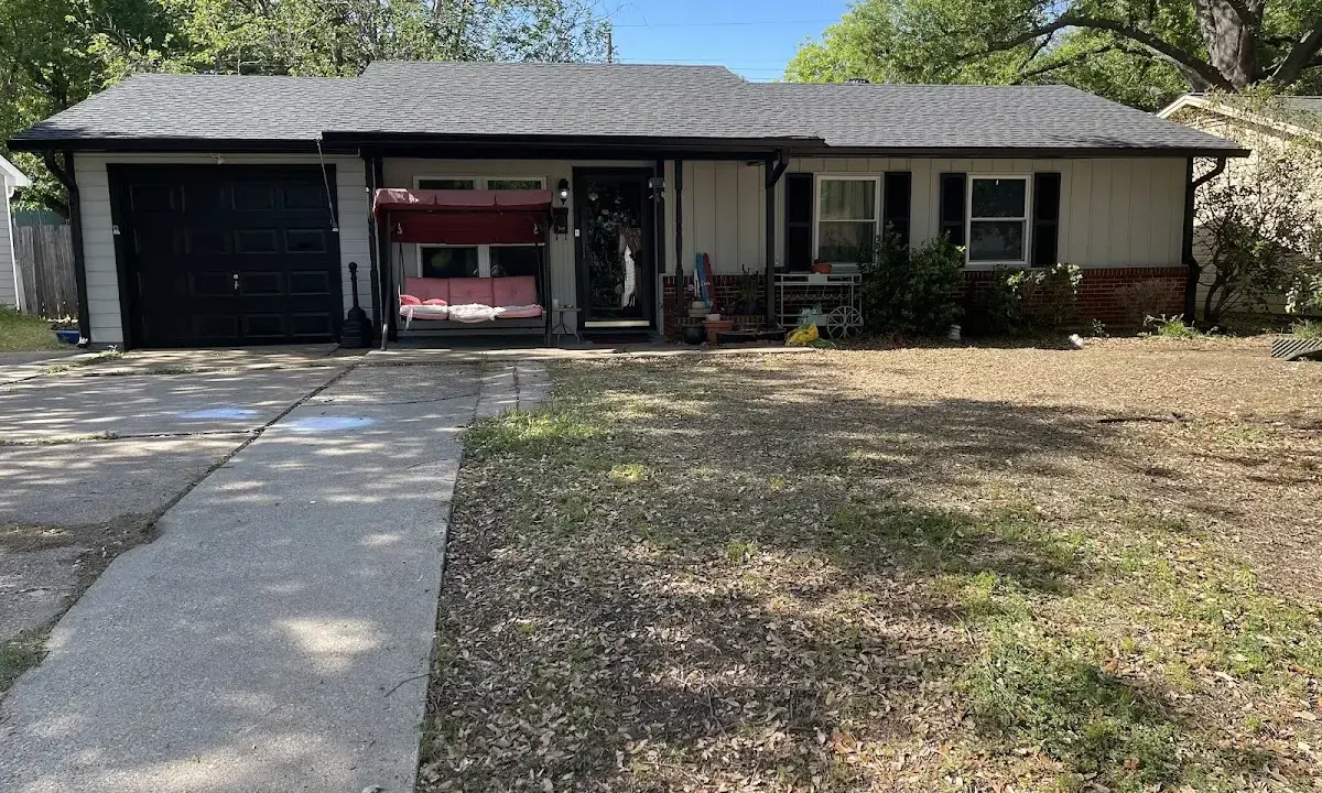 Wind Damage Roof Repair crew at work on a residential roof in Atlanta
